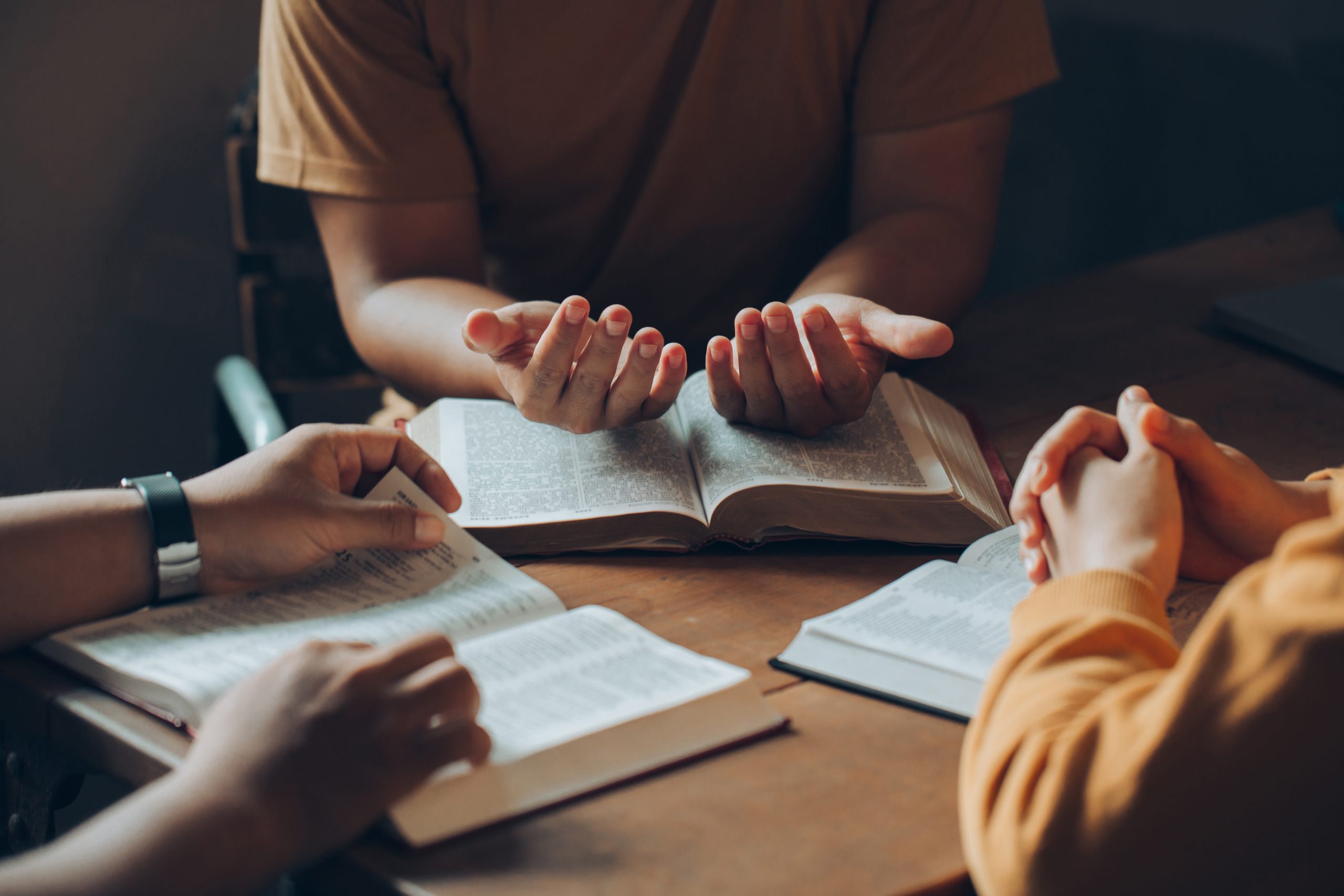 Christians and Bible study concept.Christian family sitting arou